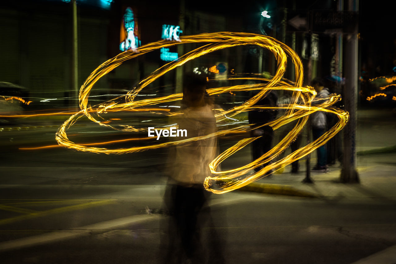 CLOSE-UP OF ILLUMINATED LIGHT TRAILS ON STAGE