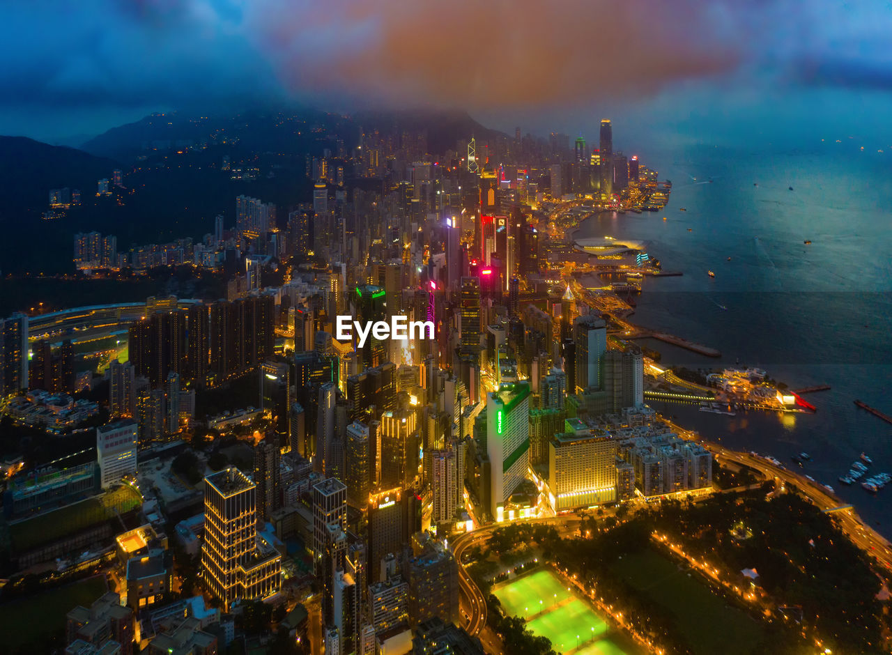 High angle view of illuminated buildings in city at night