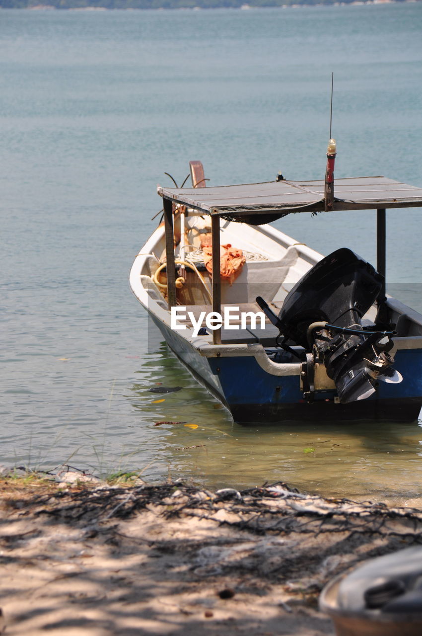 Boat moored on sea