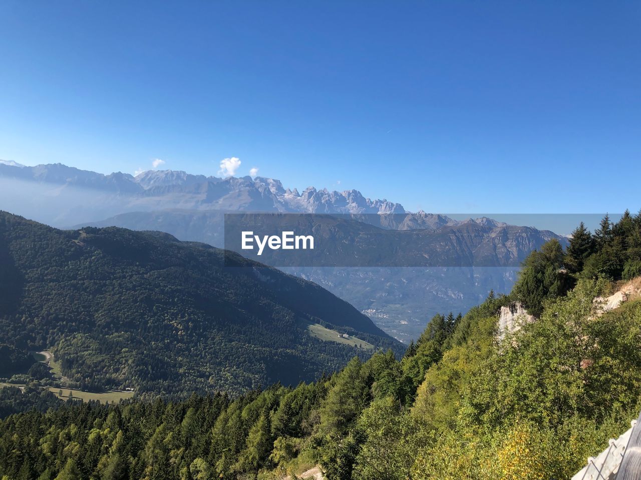 SCENIC VIEW OF MOUNTAINS AGAINST BLUE SKY