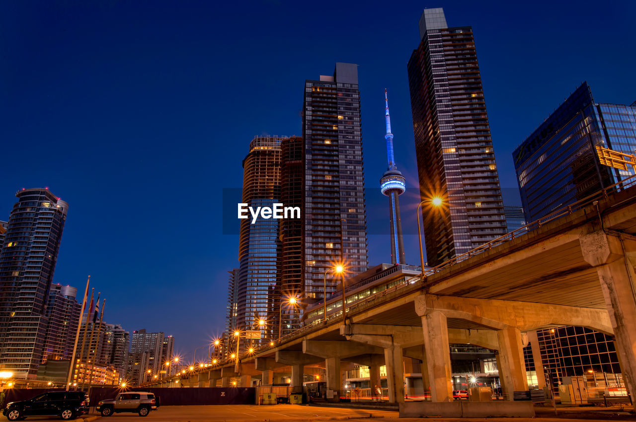 Cv tower between buildings at night