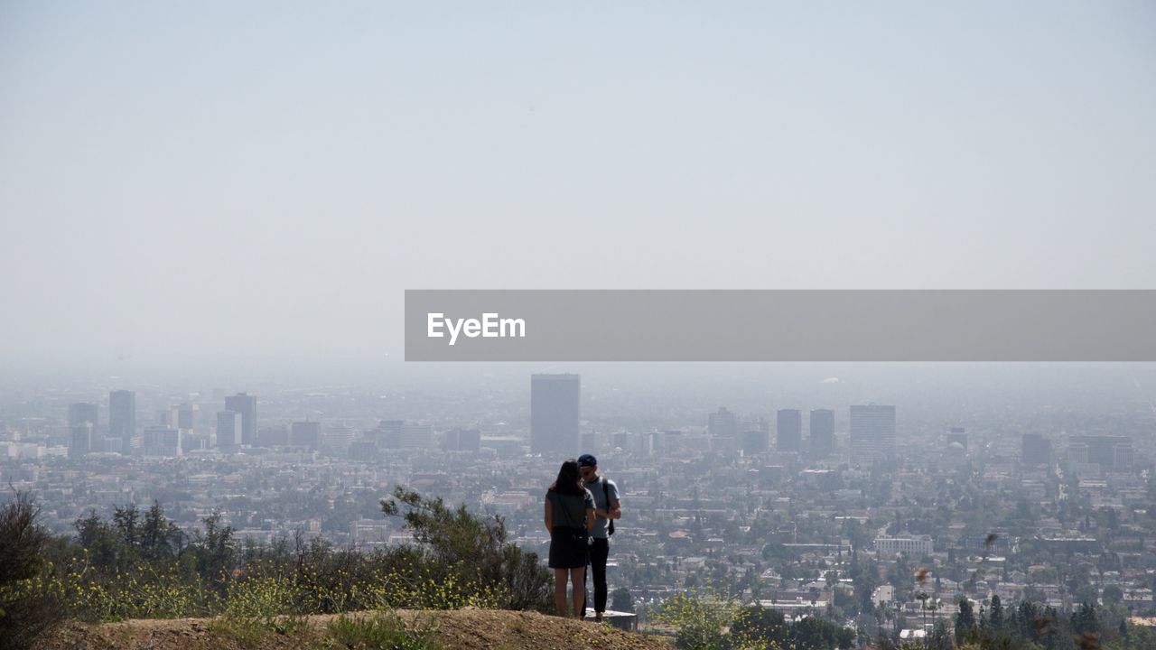 View of a couple against cityscape