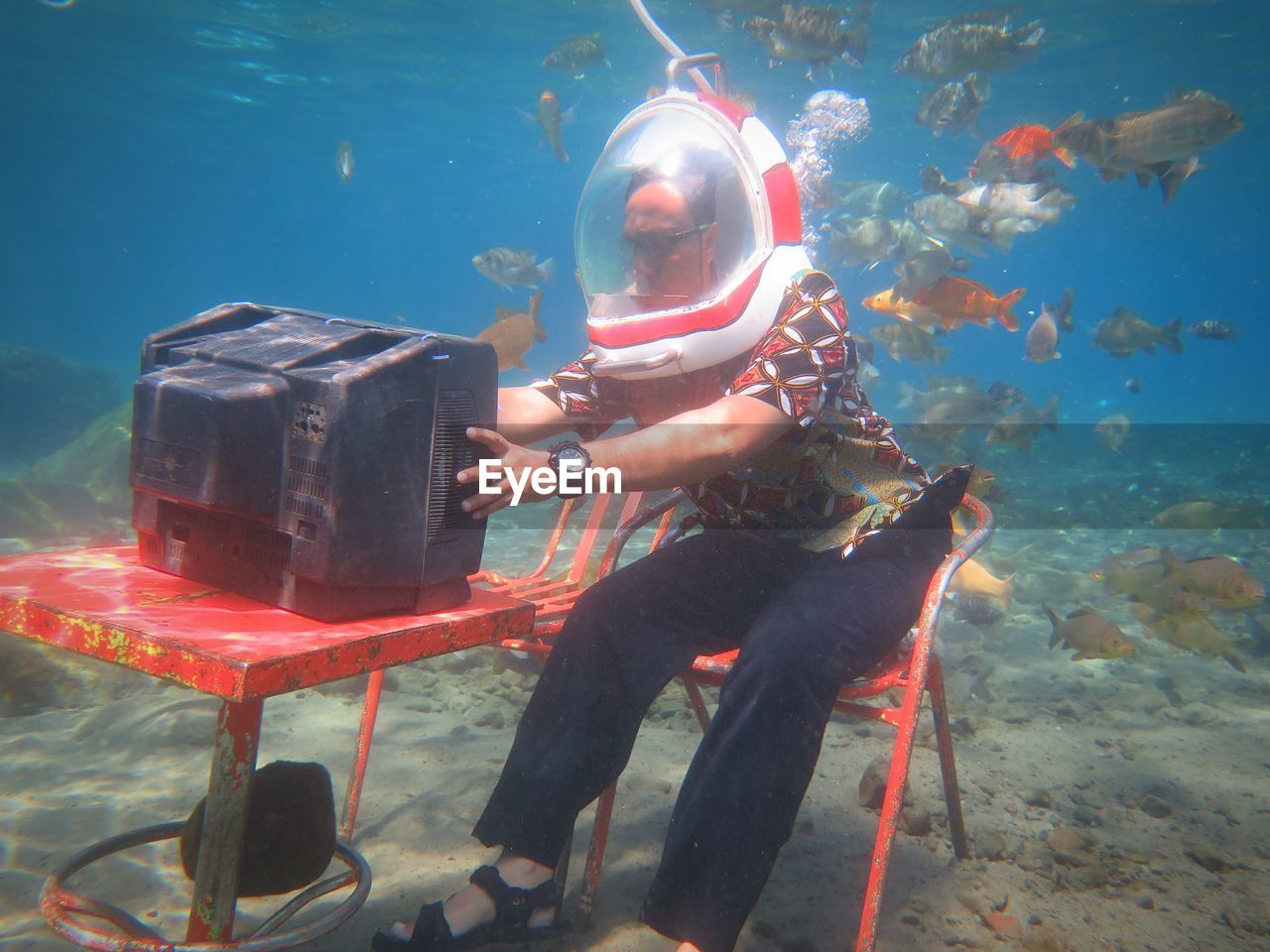 Man watching tv in sea