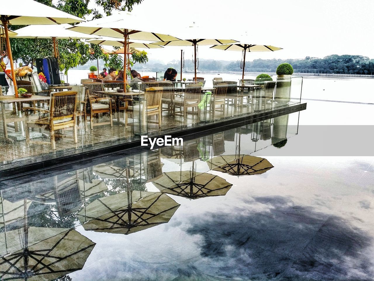 People at restaurant by infinity pool