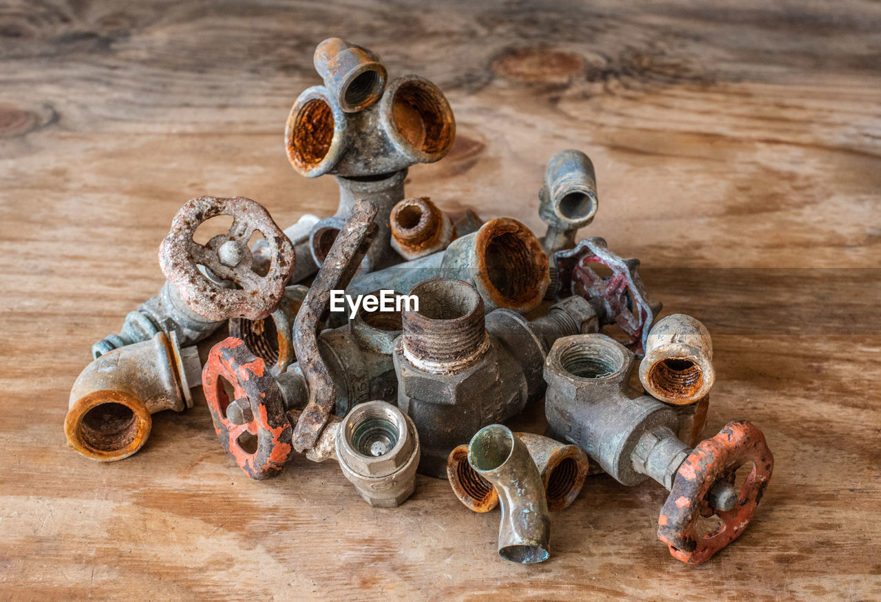 High angle view of rusty metal objects on table