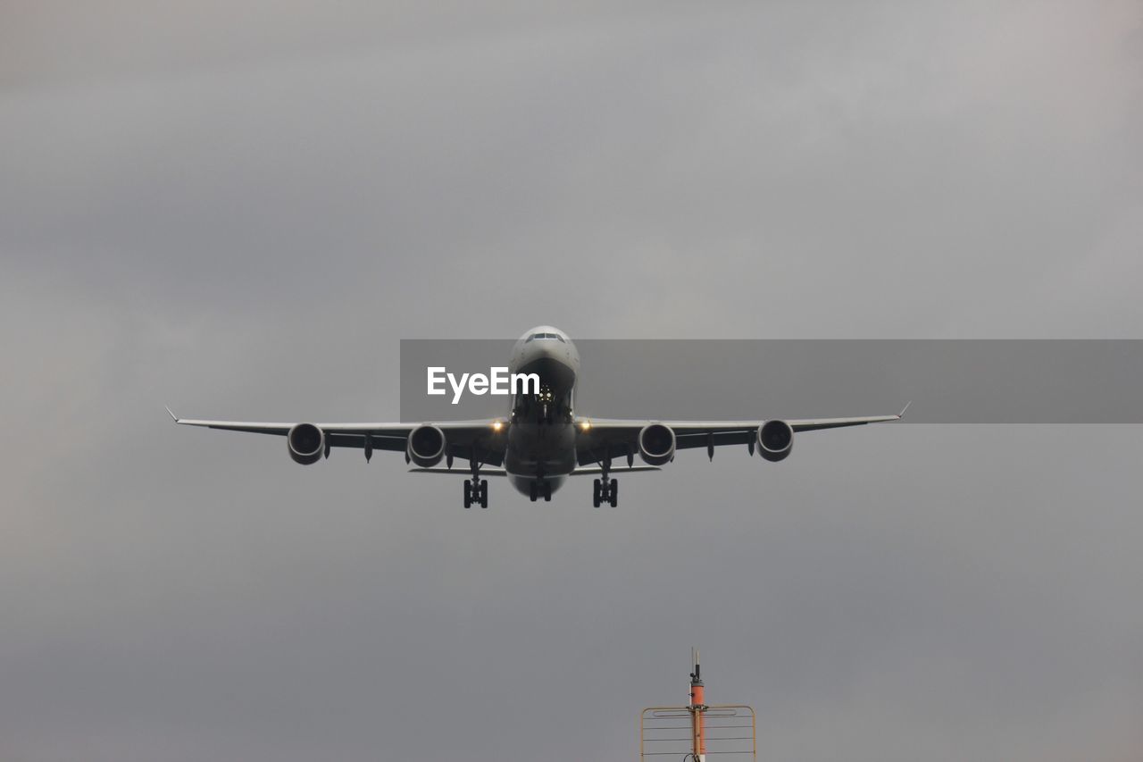 Low angle view of airplane against sky