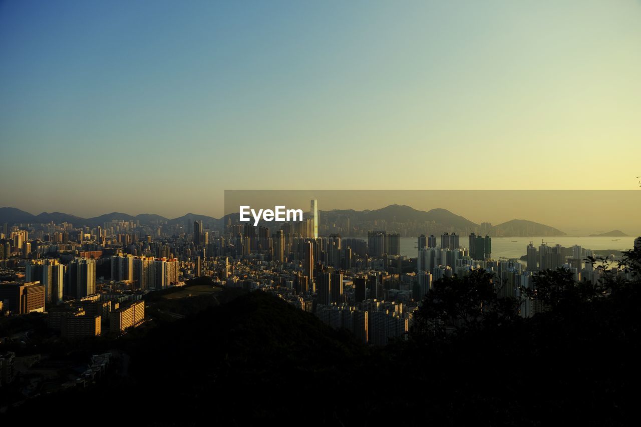 High angle view of buildings against sky during sunset