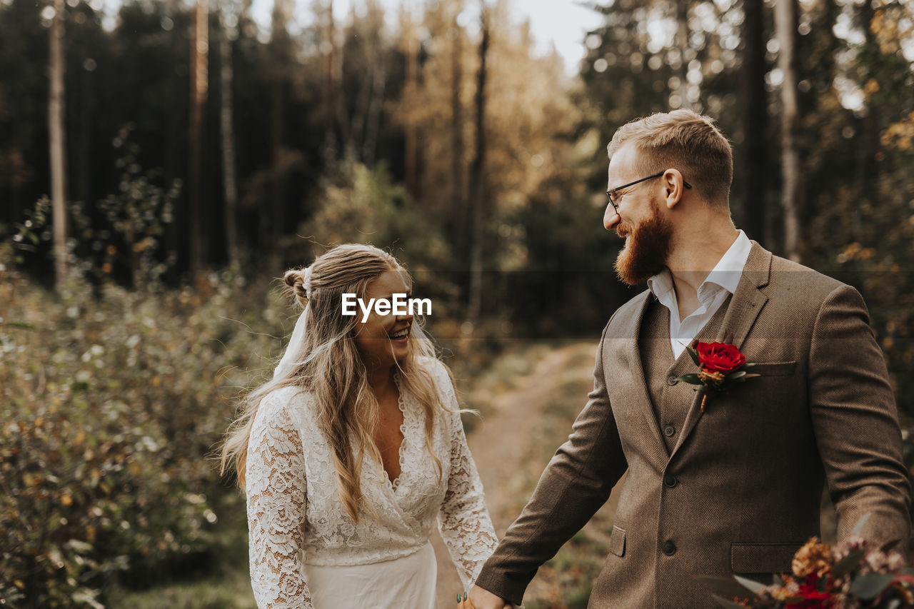 Happy bride and groom looking at each other