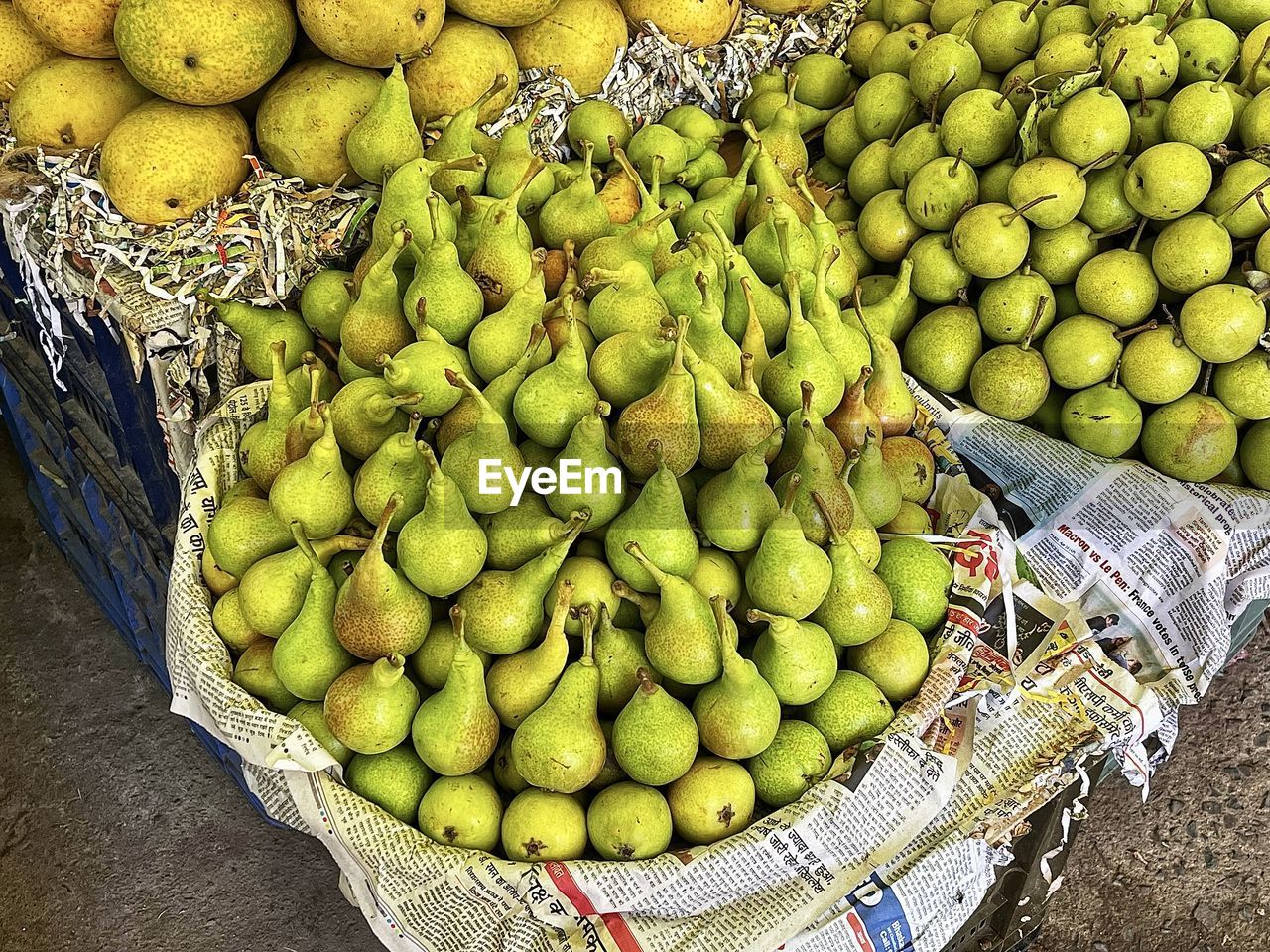food, food and drink, healthy eating, fruit, freshness, wellbeing, plant, market, abundance, retail, for sale, large group of objects, produce, market stall, high angle view, green, container, no people, basket, citrus fruit, day, small business, business, still life, sale, outdoors, arrangement, tropical fruit, variation, mango fruit, organic, collection