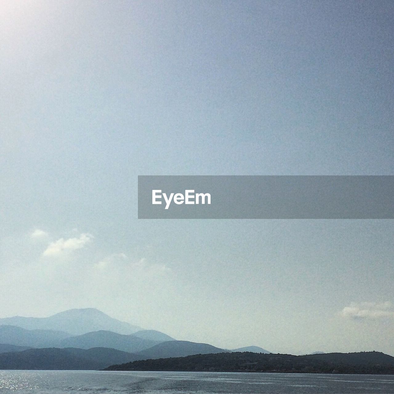 SCENIC VIEW OF LAKE BY MOUNTAINS AGAINST SKY