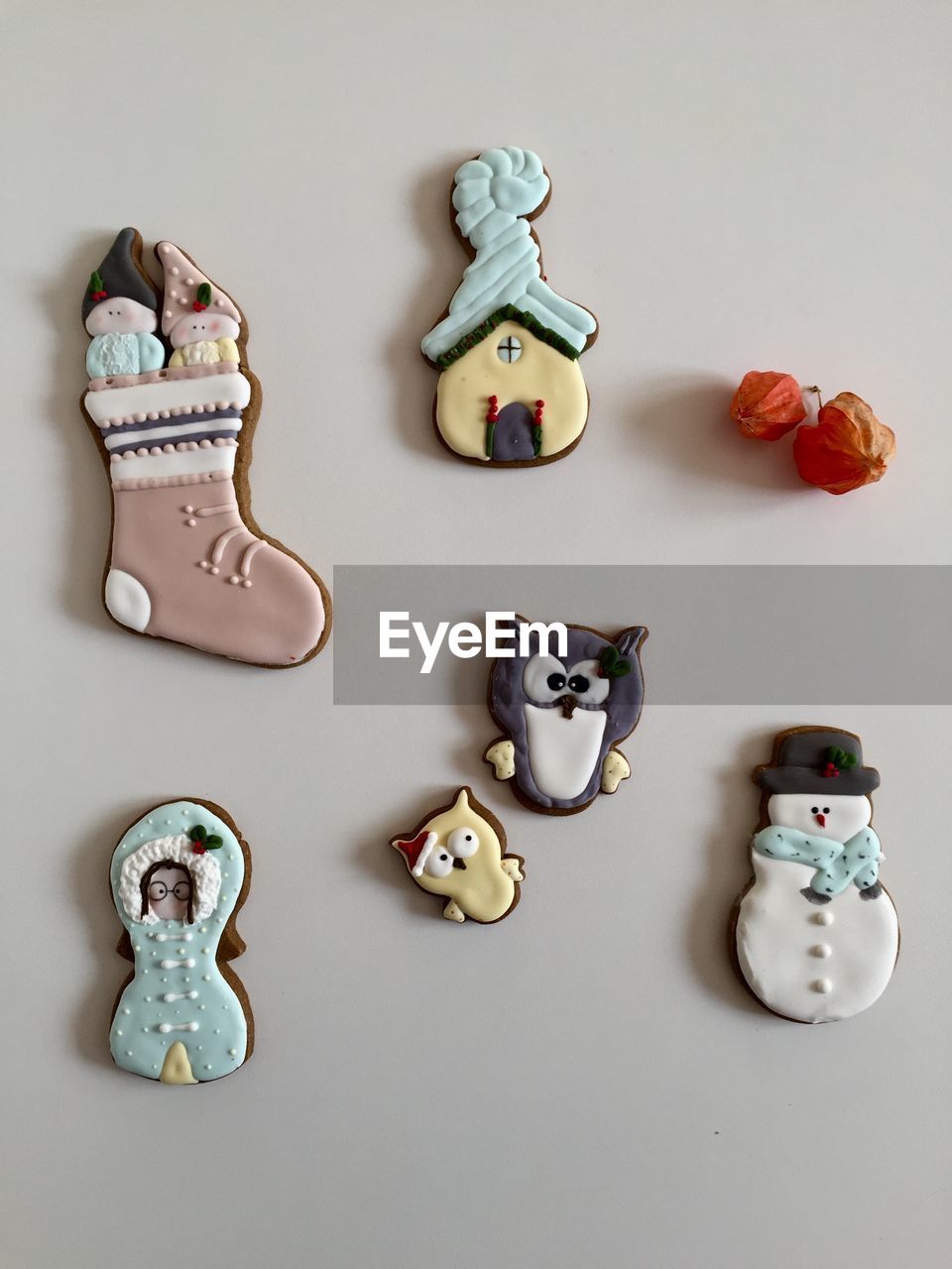 High angle view of gingerbread cookies over white background