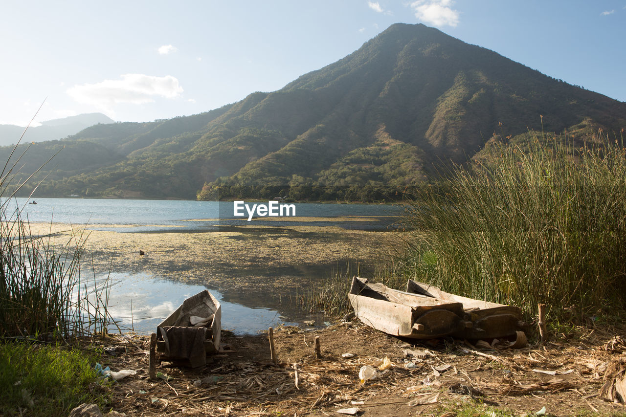 Scenic view of lake atitlan against mountain