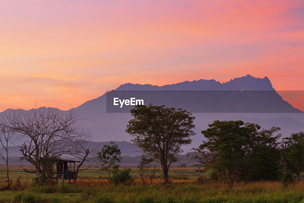 Scenic view of mountains against sky during sunset