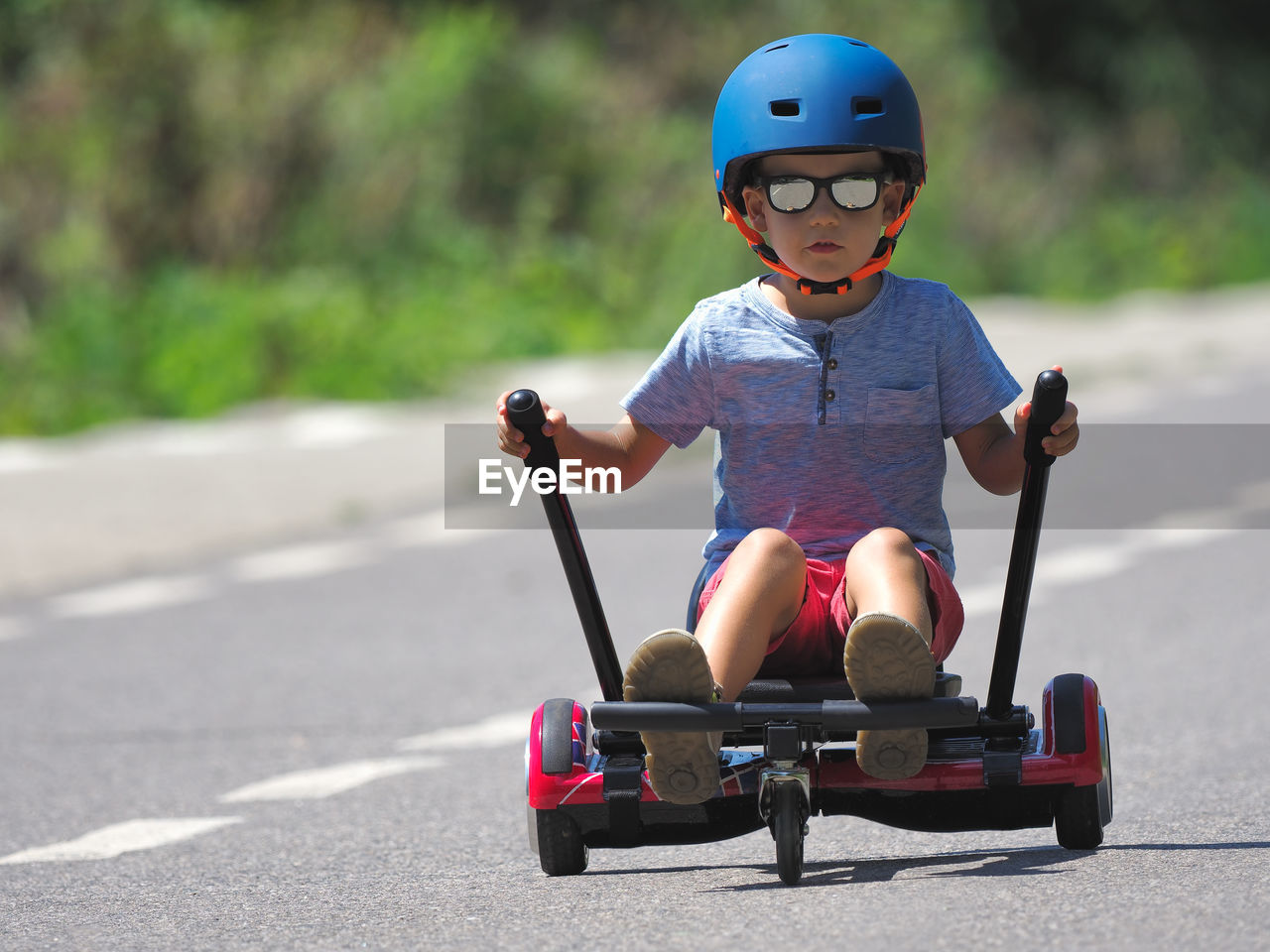 BOY RIDING SKATEBOARD