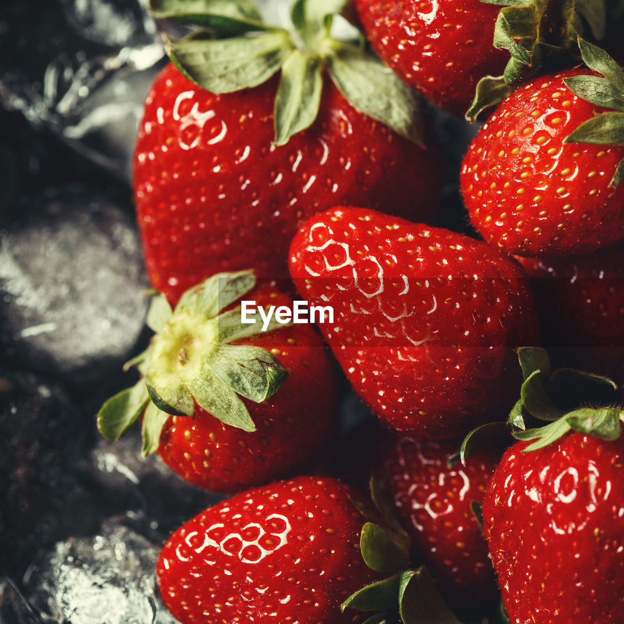 CLOSE-UP OF STRAWBERRIES IN CONTAINER