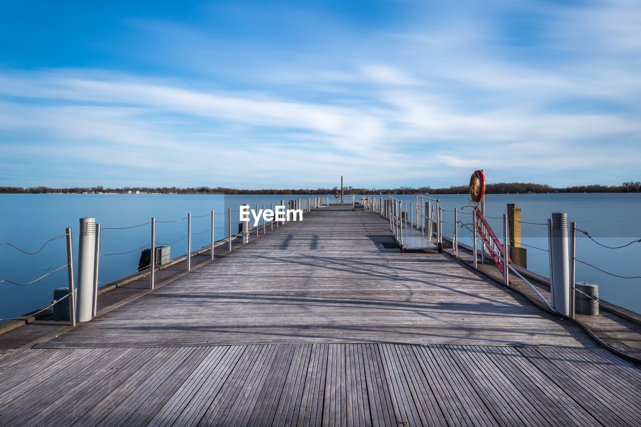 Pier over sea against sky