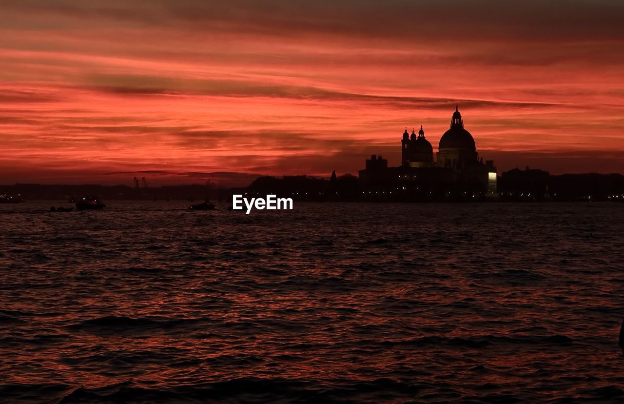 scenic view of sea against orange sky