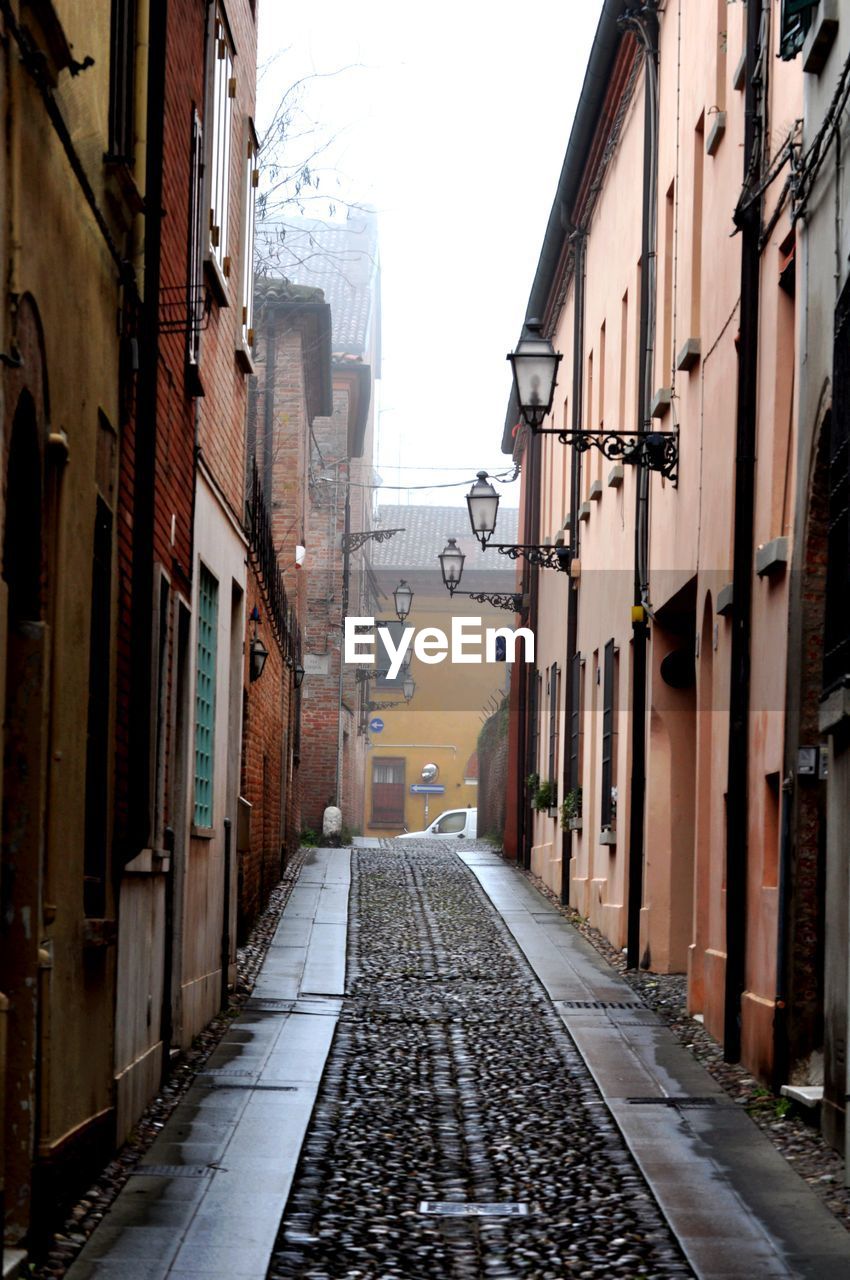 street amidst buildings against sky