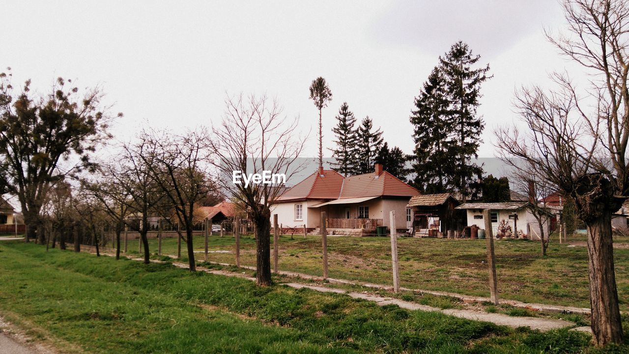 HOUSES AGAINST SKY