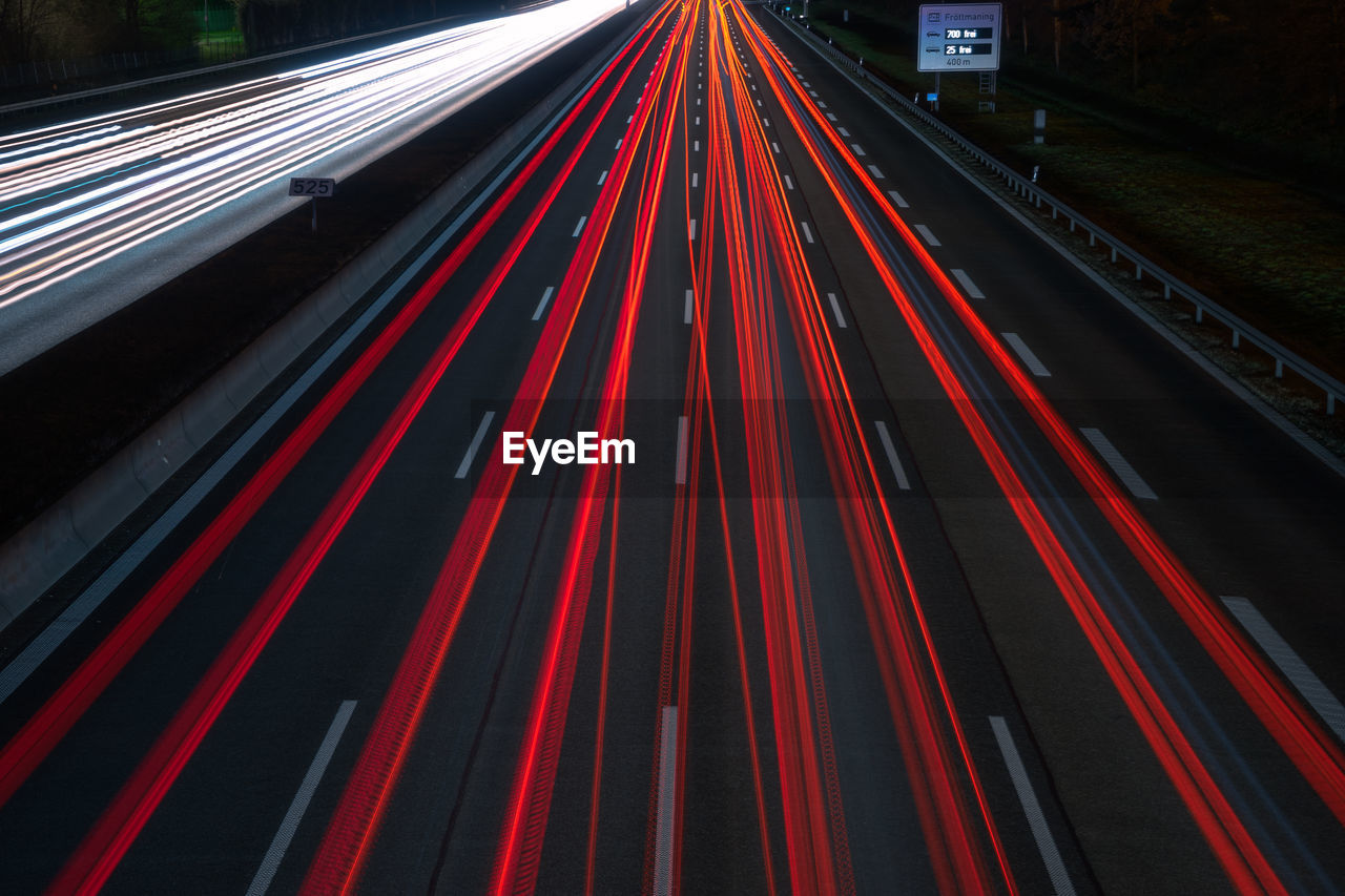 High angle view of light trails on road in city