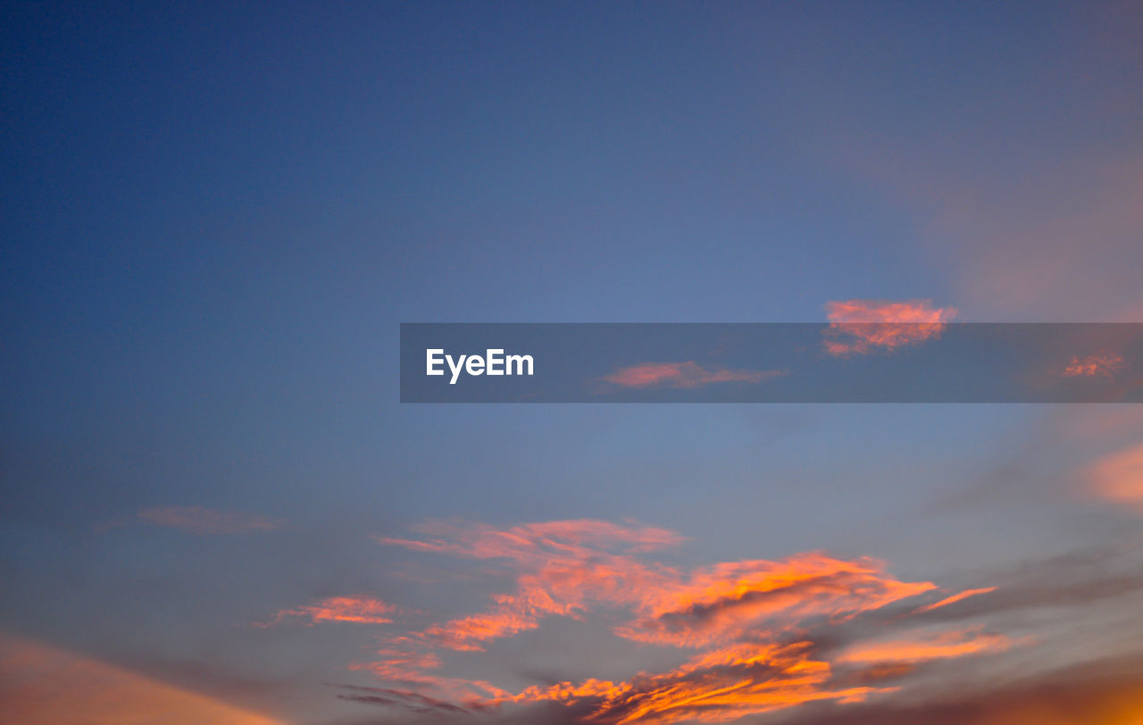 LOW ANGLE VIEW OF CLOUDY SKY AT SUNSET