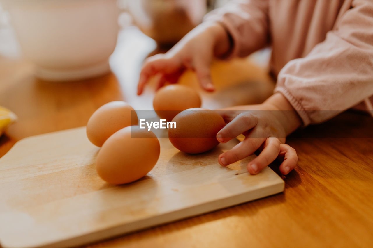 Child picking eggs