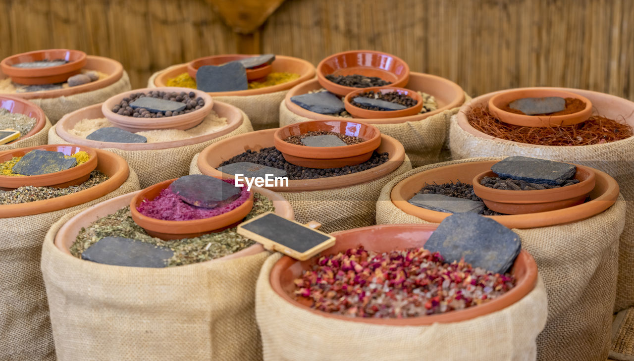 Various spices and flavorings in bowls and bags