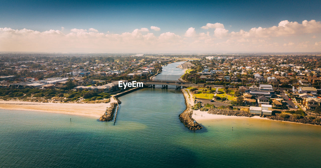 HIGH ANGLE VIEW OF CITY AT WATERFRONT