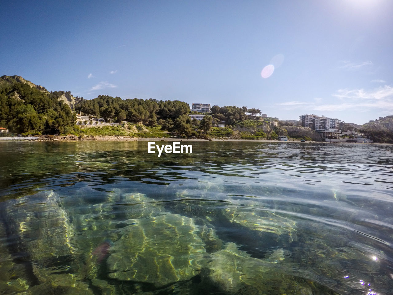 VIEW OF CITY BY SEA AGAINST SKY