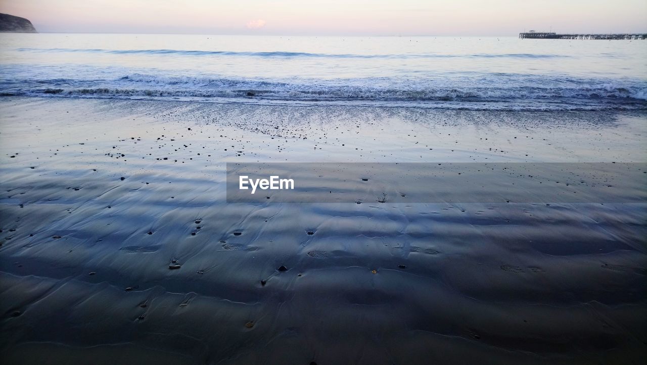 SCENIC VIEW OF SEA DURING SUNSET