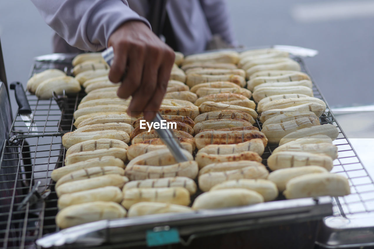 Grilled bananas are sold and prepared on the streets