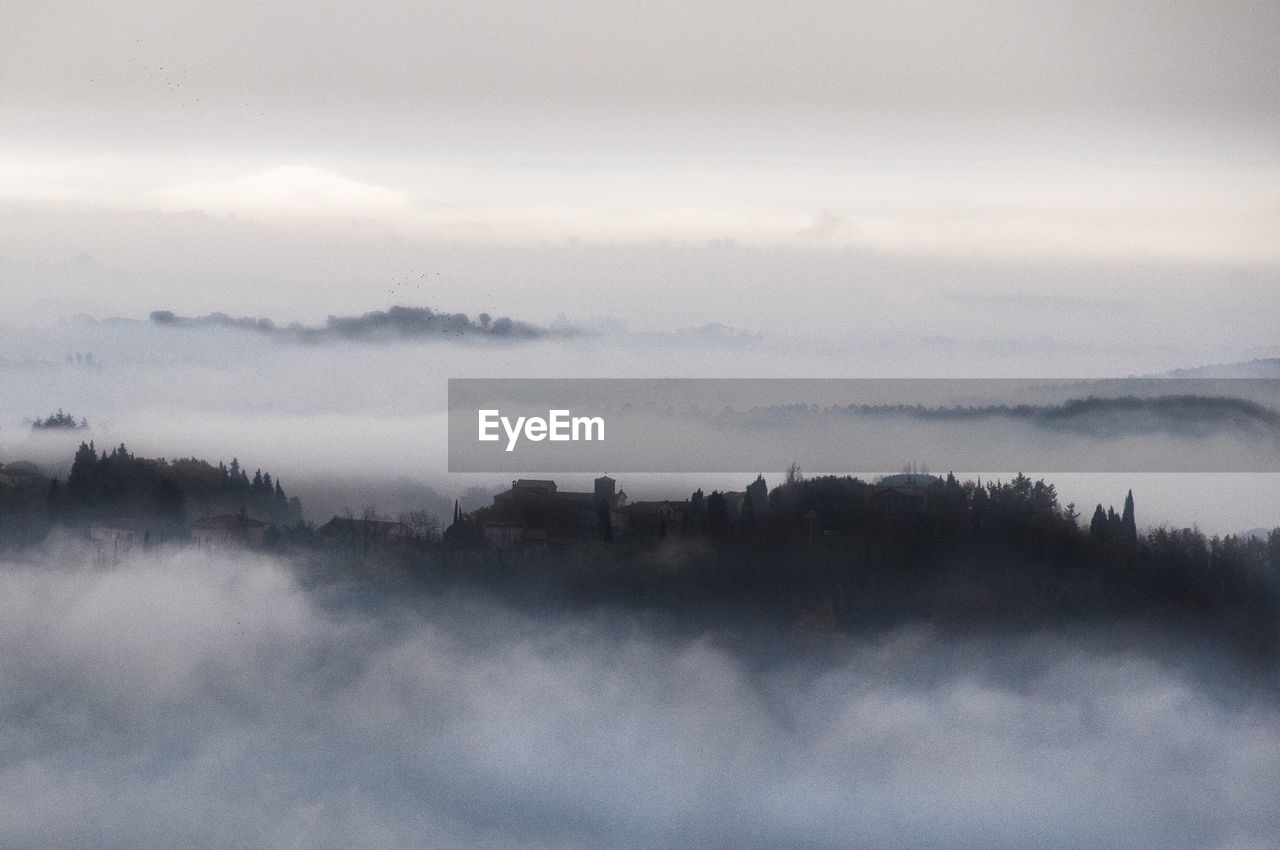 Clouds over countryside landscape