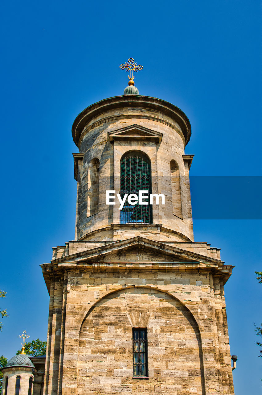 Low angle view of church against blue sky