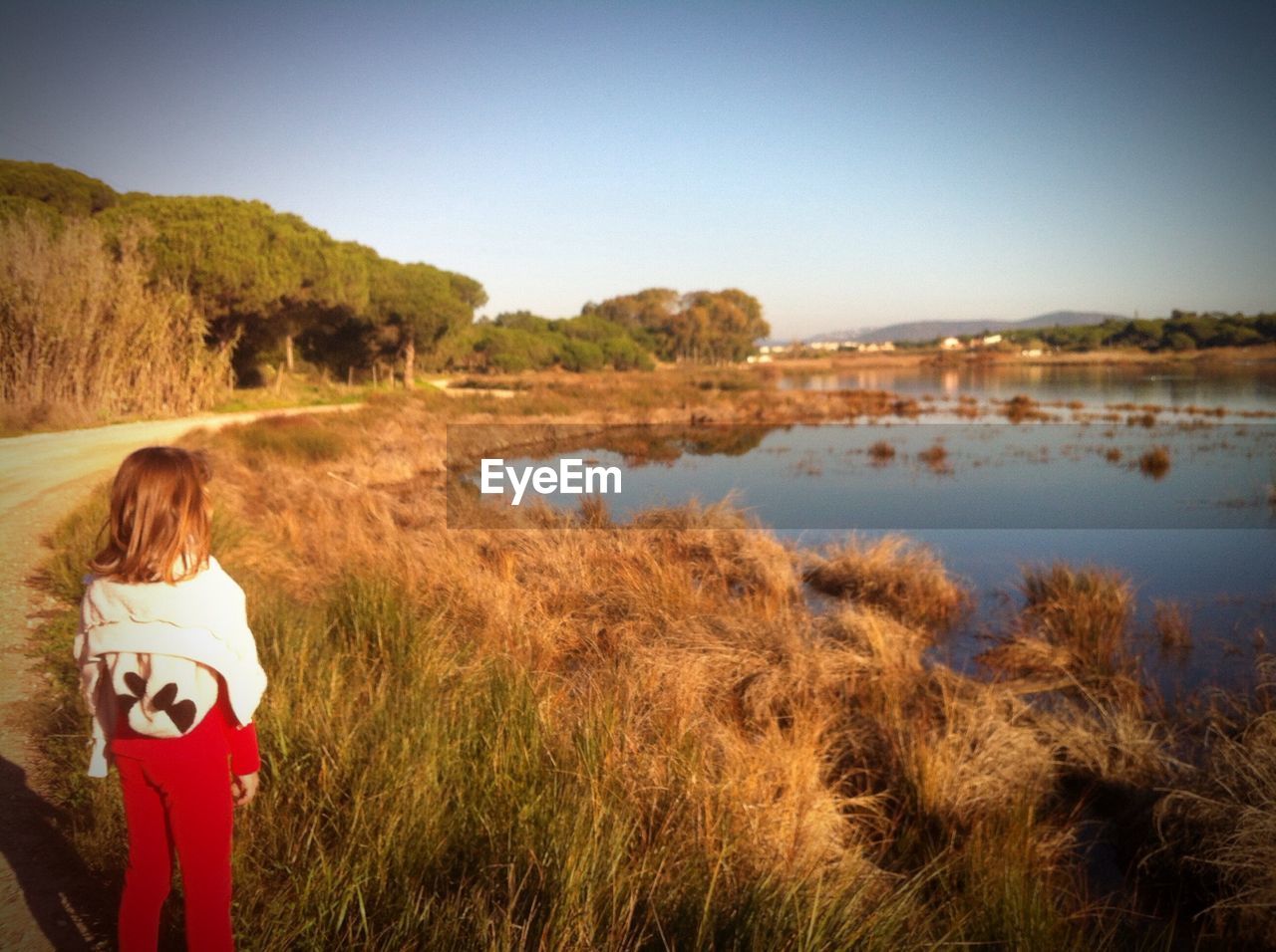 Girl looking at lake