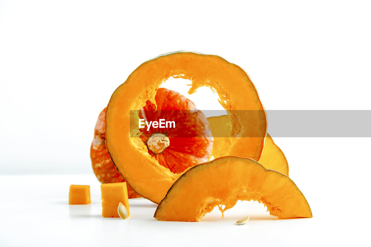 orange, food and drink, food, orange color, healthy eating, fruit, produce, plant, cut out, yellow, wellbeing, white background, studio shot, freshness, pumpkin, indoors, citrus fruit, no people, flower, vegetable, slice