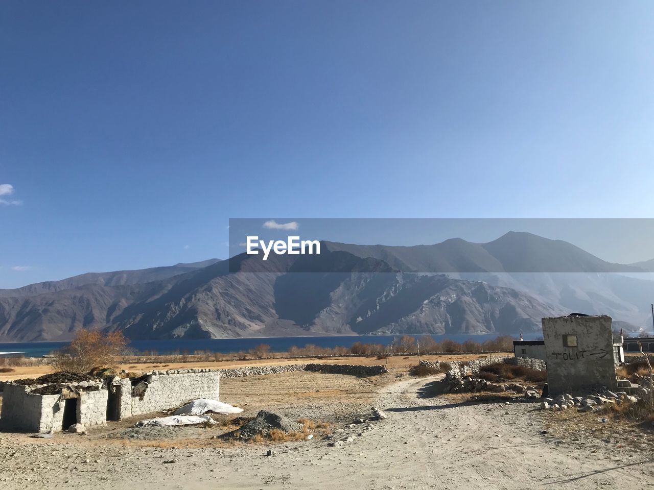 Scenic view of mountains against clear blue sky