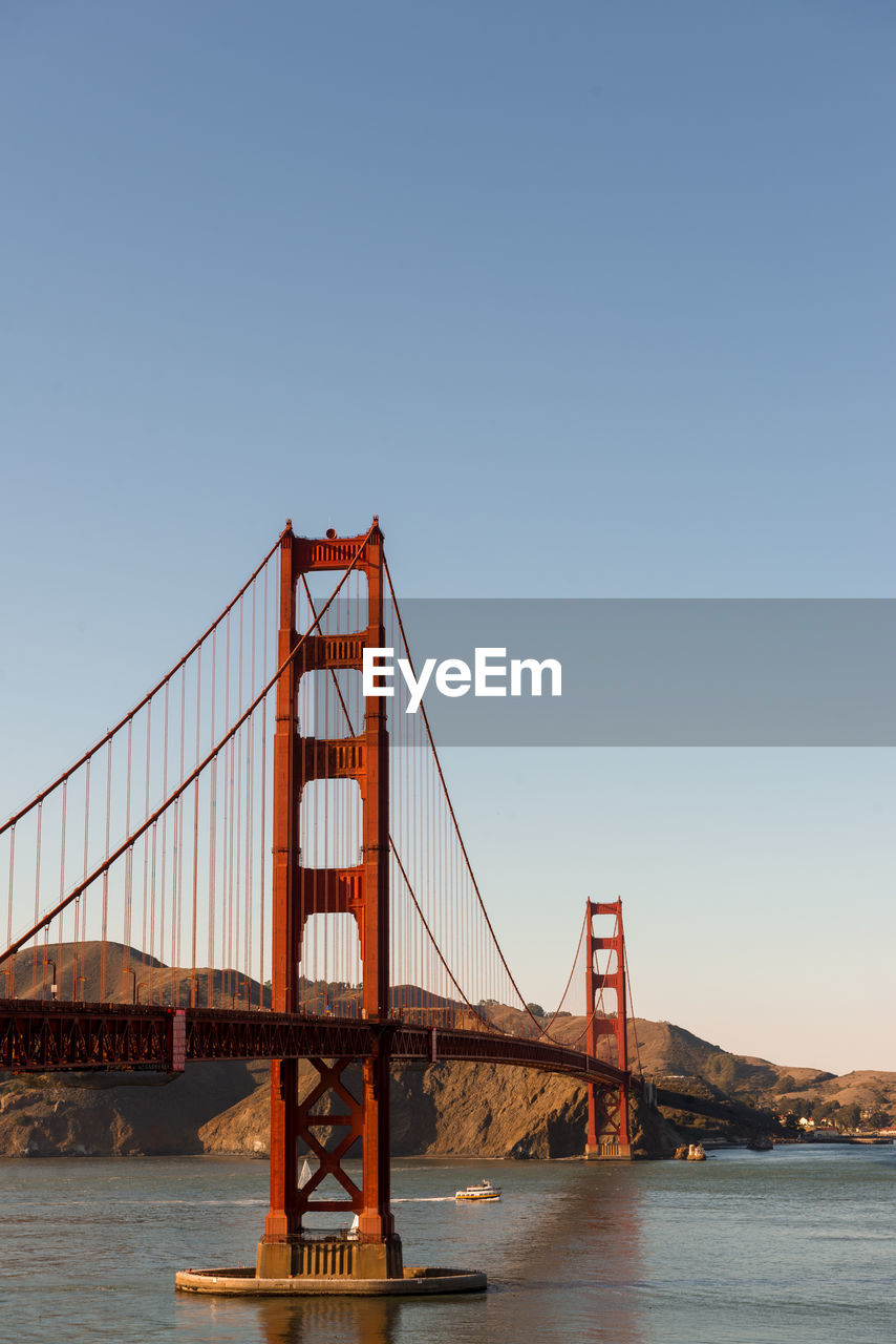 VIEW OF SUSPENSION BRIDGE AGAINST SKY