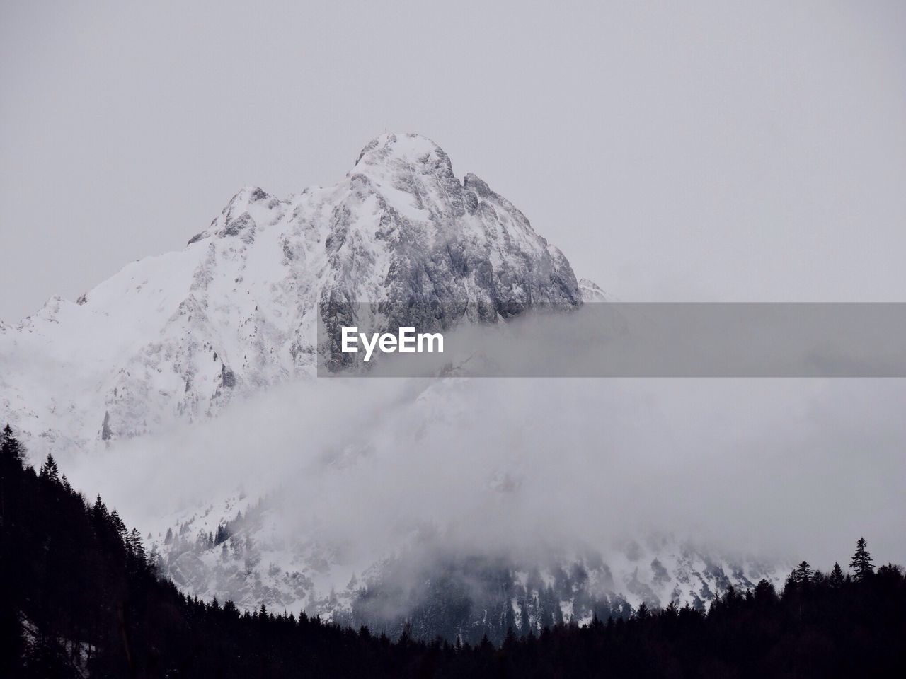 Scenic view of snowcapped mountain against sky