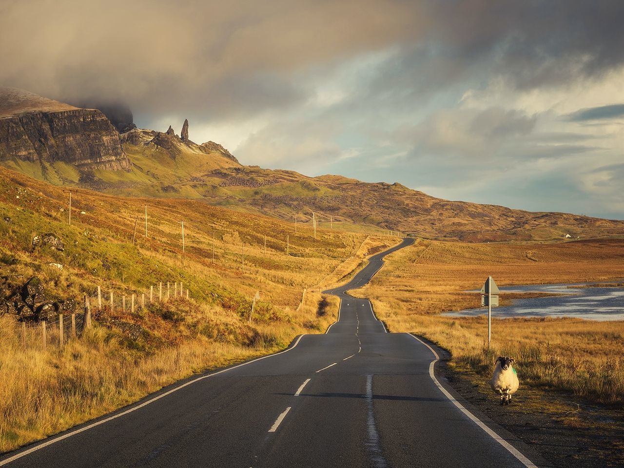 Road amidst landscape against sky