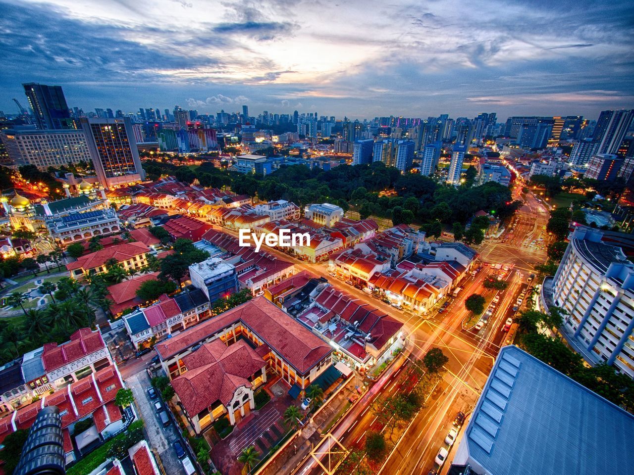 High angle view of illuminated cityscape against sky