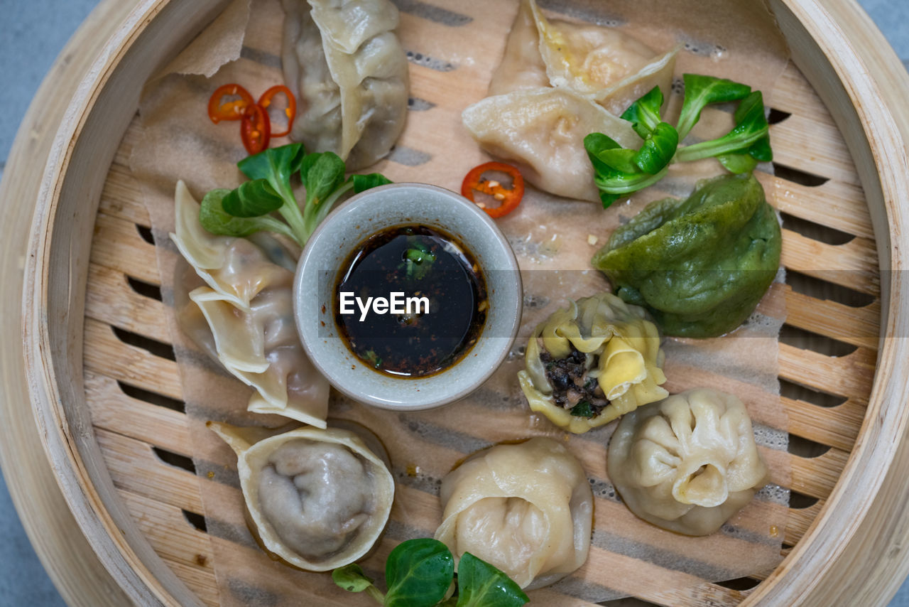 Directly above shot of dumplings in bamboo steamer