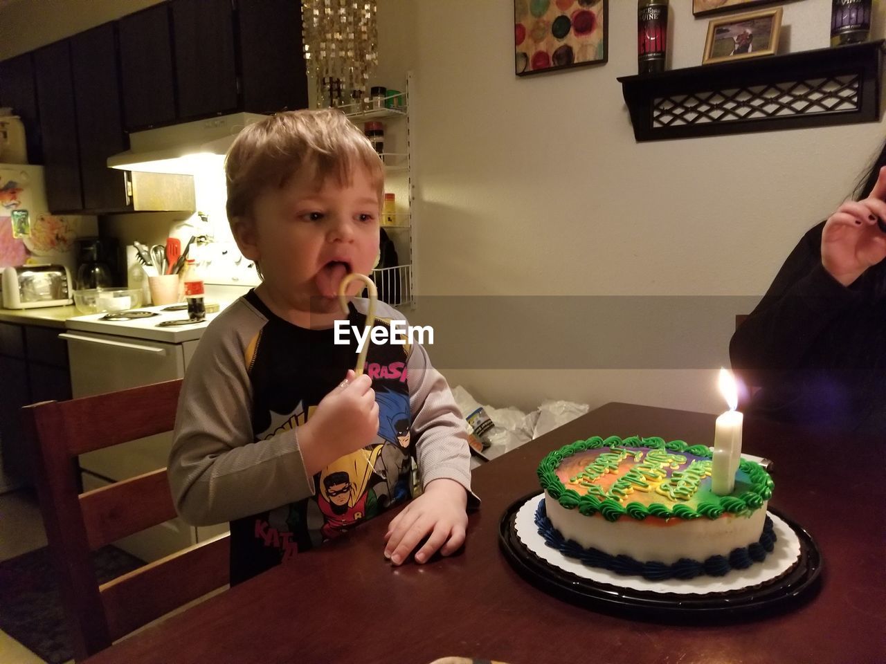 HIGH ANGLE VIEW OF FATHER AND SON ON TABLE