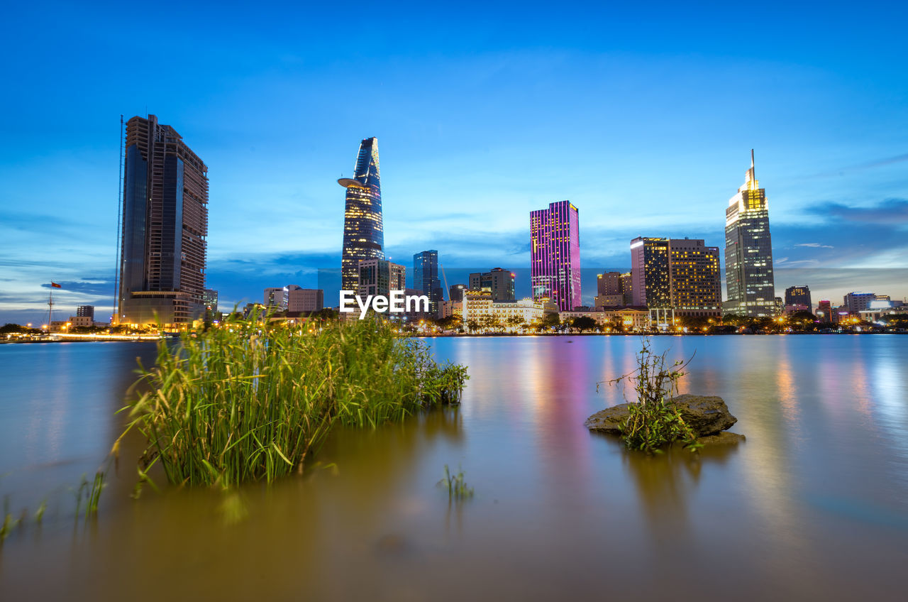 REFLECTION OF CITY IN RIVER