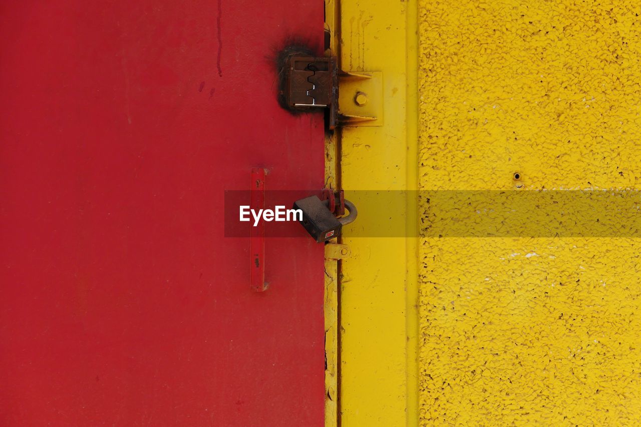 Close-up of locked red door