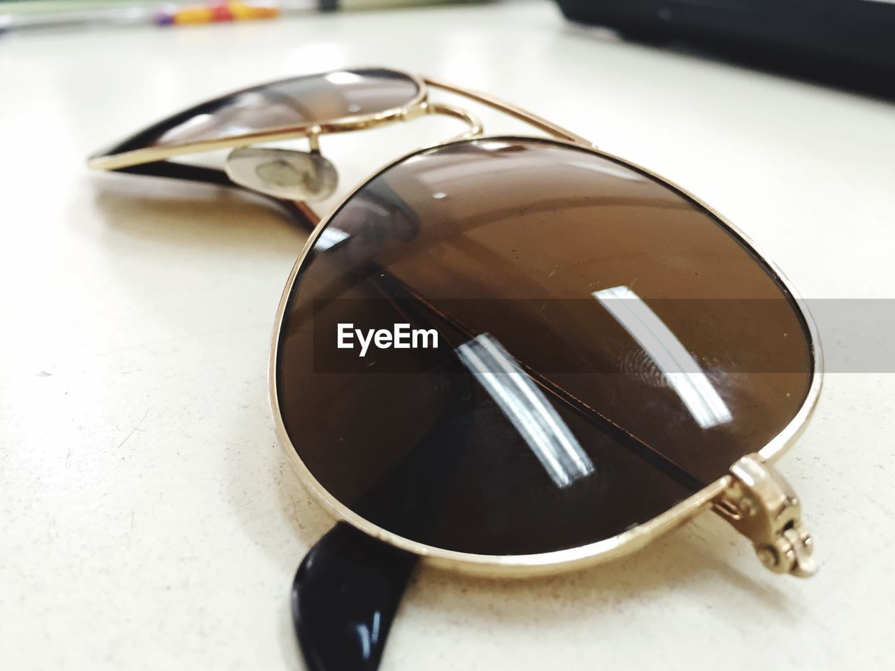 Close-up of sunglasses on table