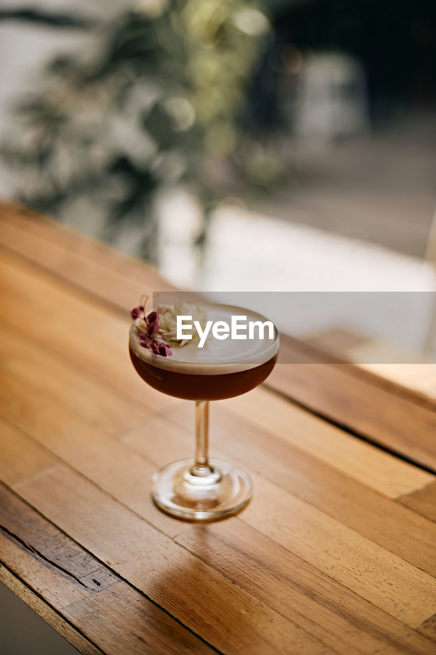 close-up of drink on wooden table