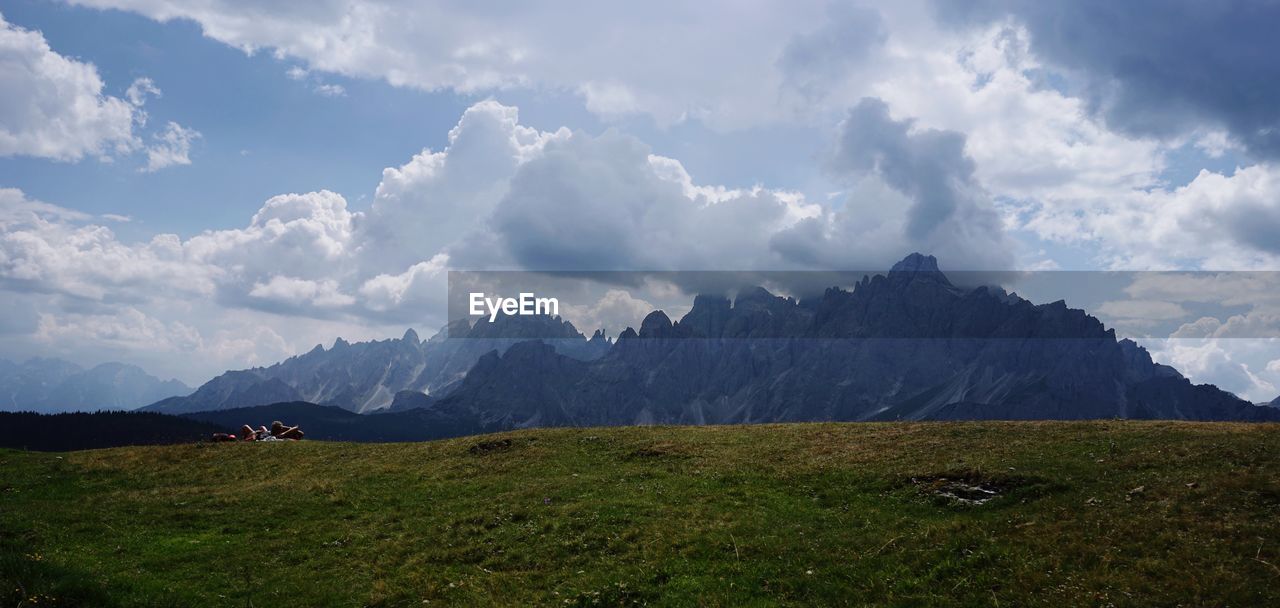 Scenic view of landscape and mountains against sky