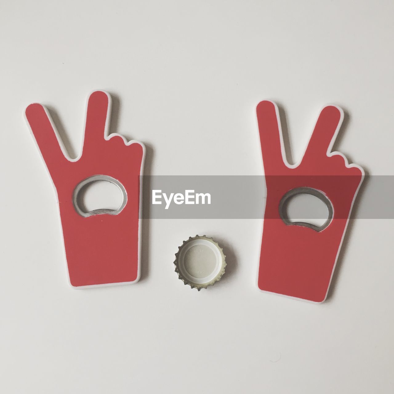 Close-up of bottle opener on white wall