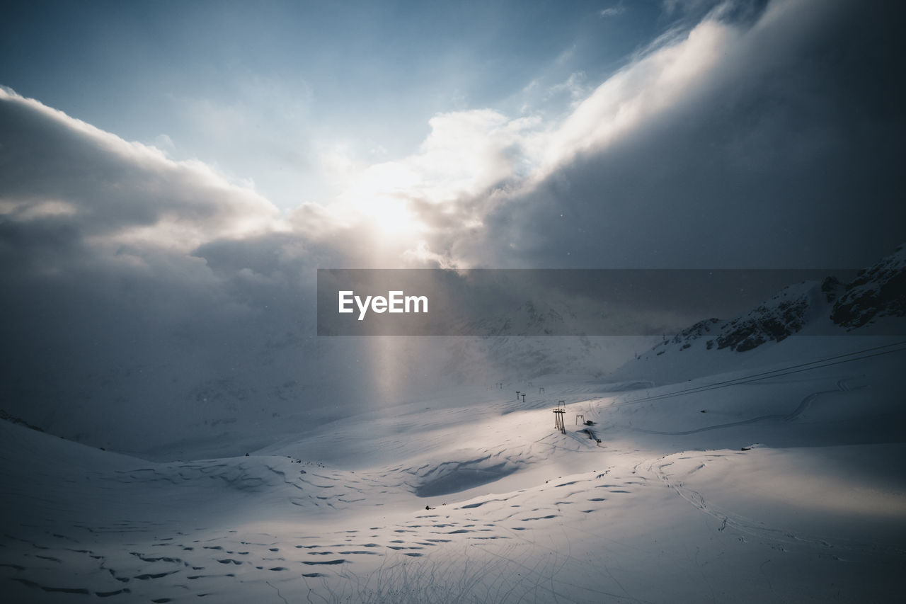 Golden sunset light illuminating winter wonderland in mountain region, gastein, salzburg, austria