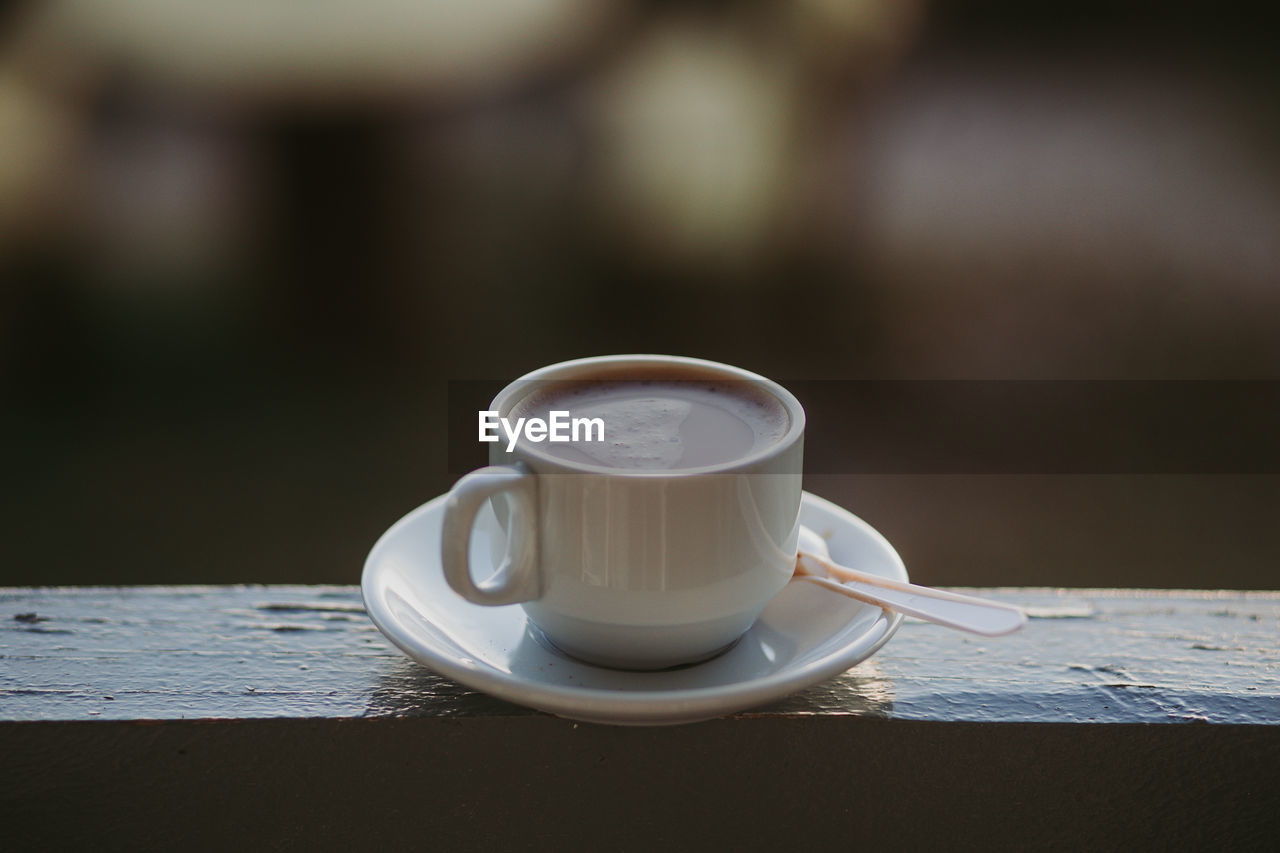 Close-up of coffee cup on table